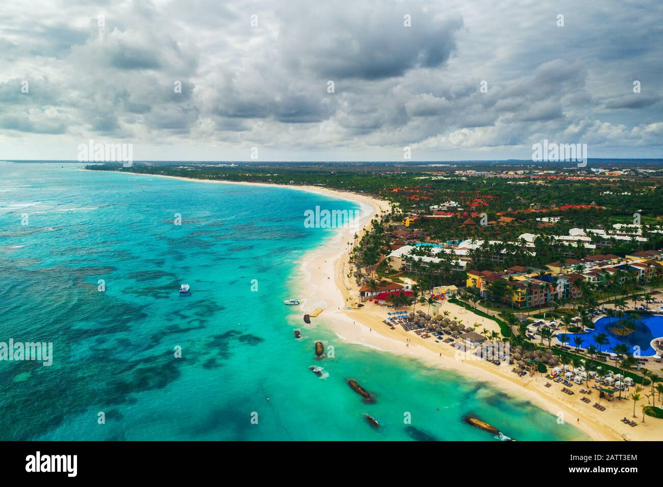 Aerial view of Punta Cana beach resort, Dominican Republic. Summer holiday with parasailing, diving, swimming, sunbathing. Stock Photo