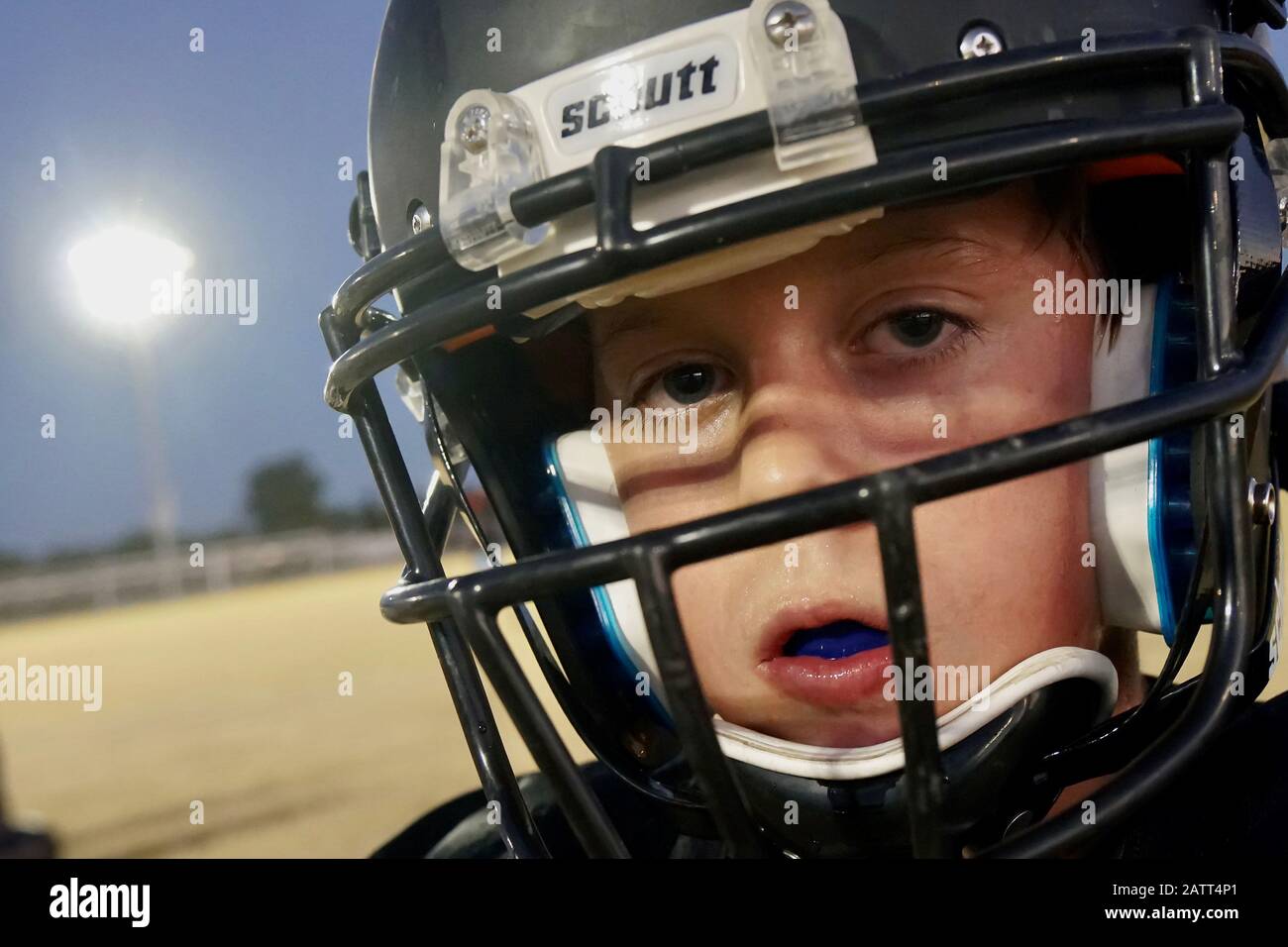 A youth football player poses for a portrait. Stock Photo