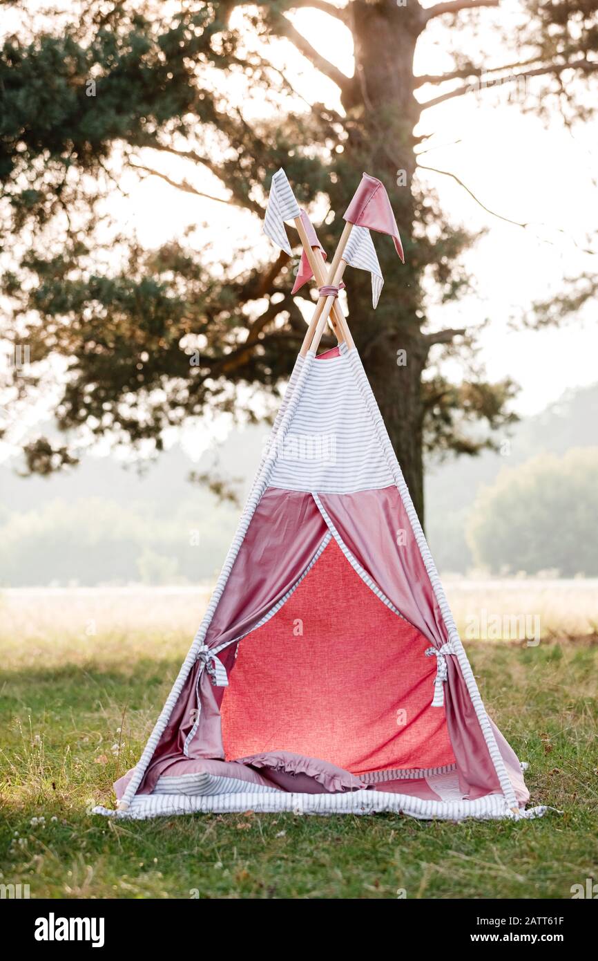 baby pink house wigwam in the park on summer. Summer, happy childhood  concept Stock Photo - Alamy