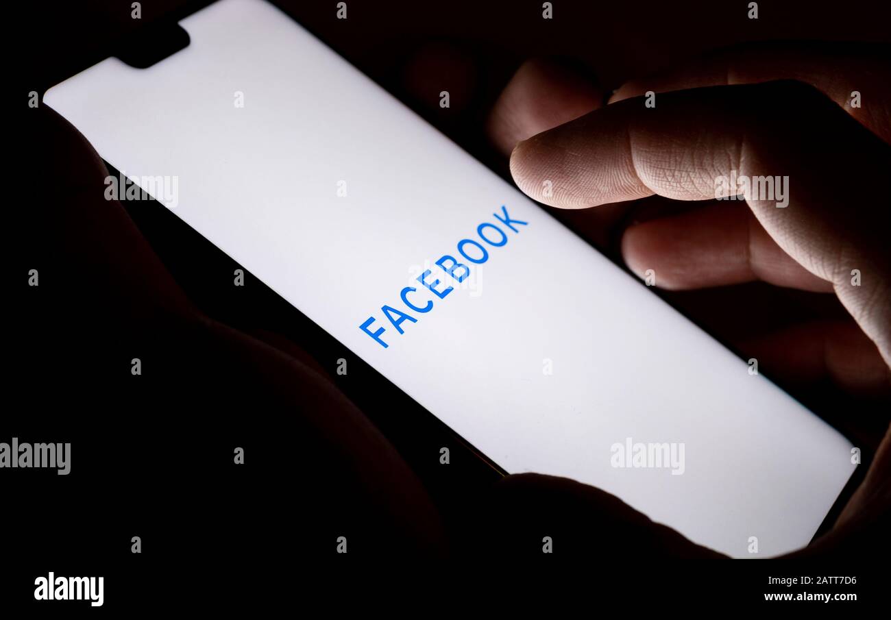 New Facebook company logo on the screen and finger pointing at it. Concept photo. Stock Photo