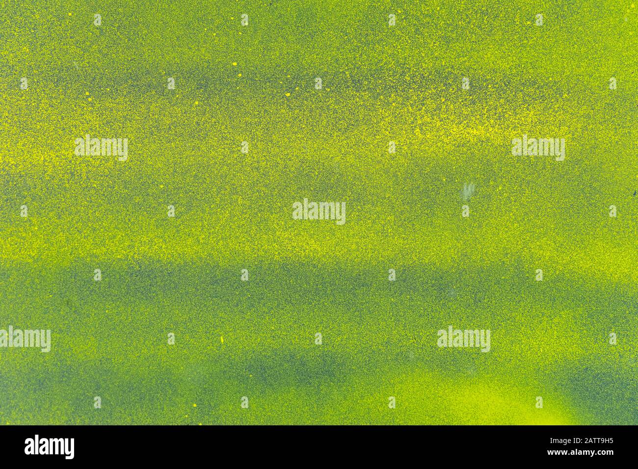 Metal sheet sprayed with bright green-yellow paint. With slight horizontal stripes. The surface smeared,  with dirt. Abstract colorful texture backgro Stock Photo