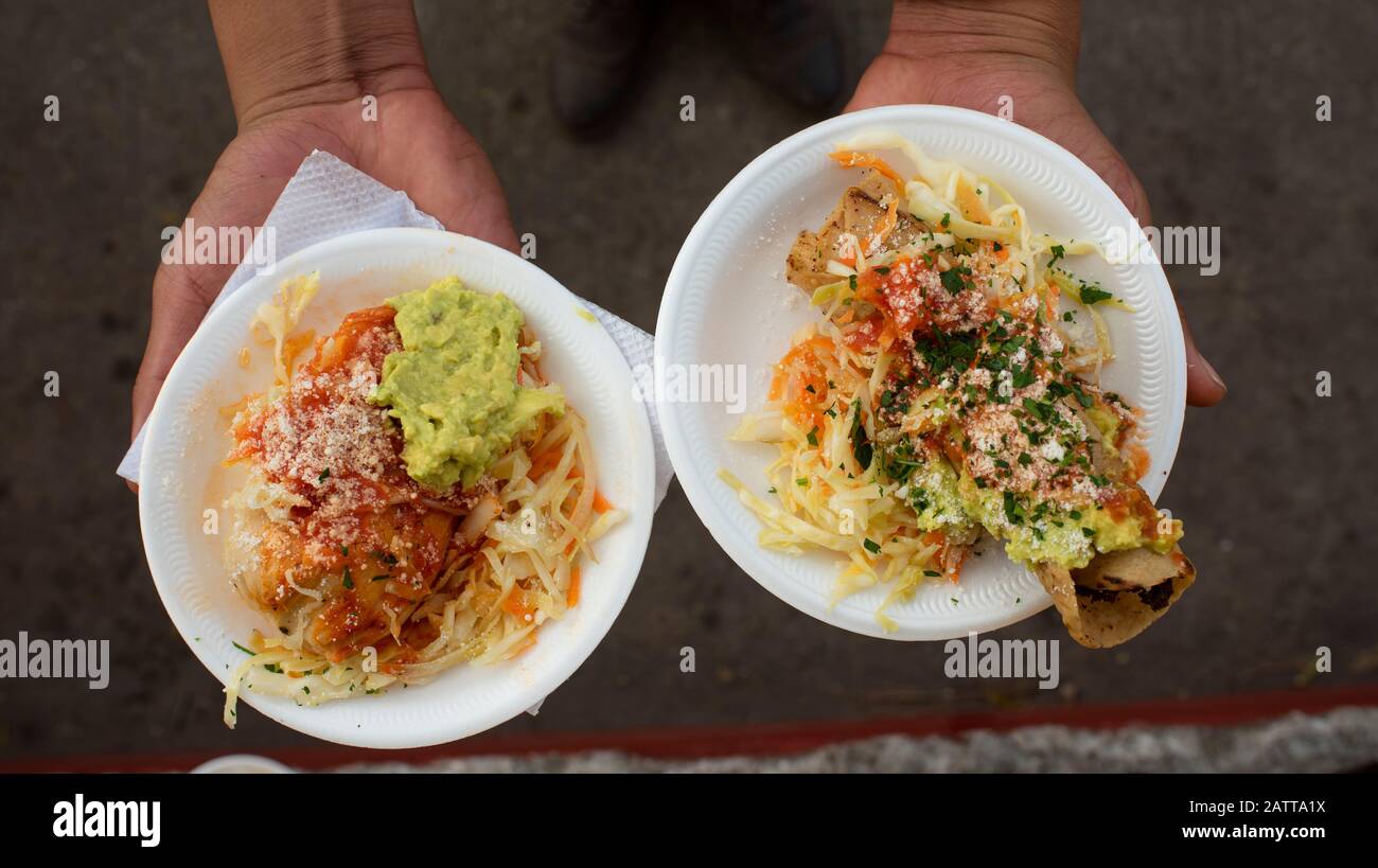 Traditional Guatemalan street food snacks. Doblada with curtido (slightly fermented cabbage with carrots and spices). Antigua, Guatemala. Jan 2019 Stock Photo