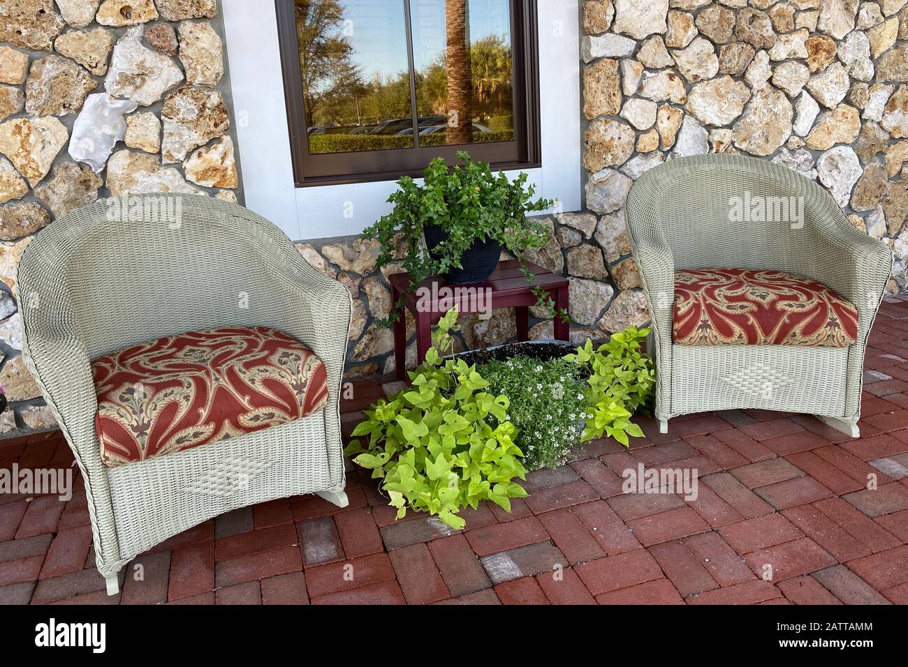 pair of southern style cobblestone porch chairs Stock Photo