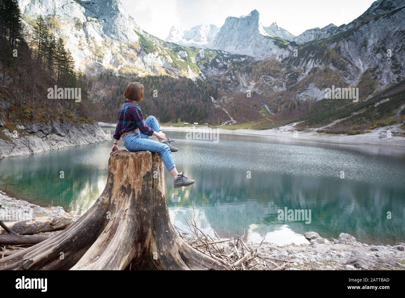 Girl sits on shore mountain hi-res stock photography and images - Alamy