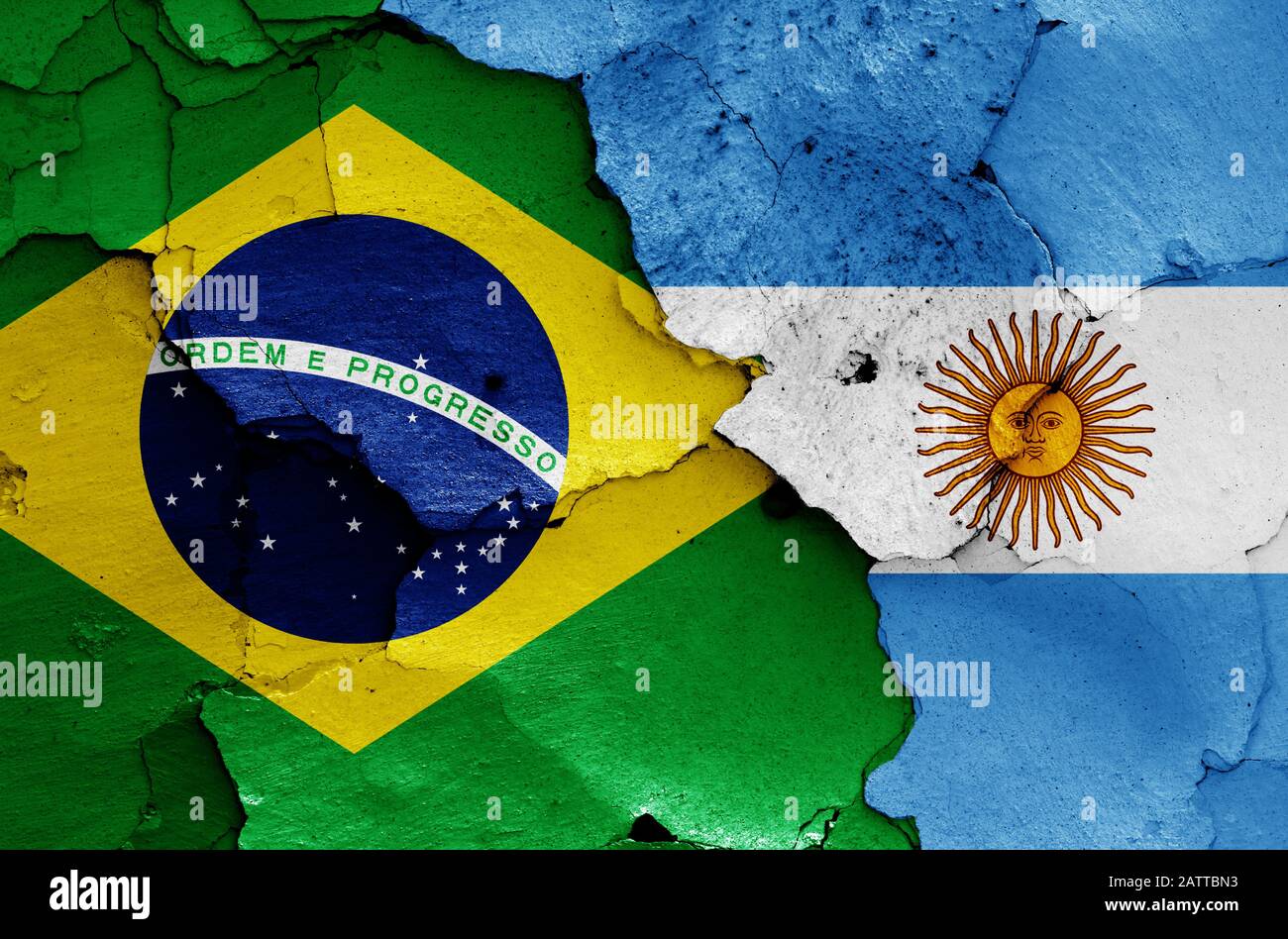 flags of Brazil and Argentina painted on cracked wall Stock Photo