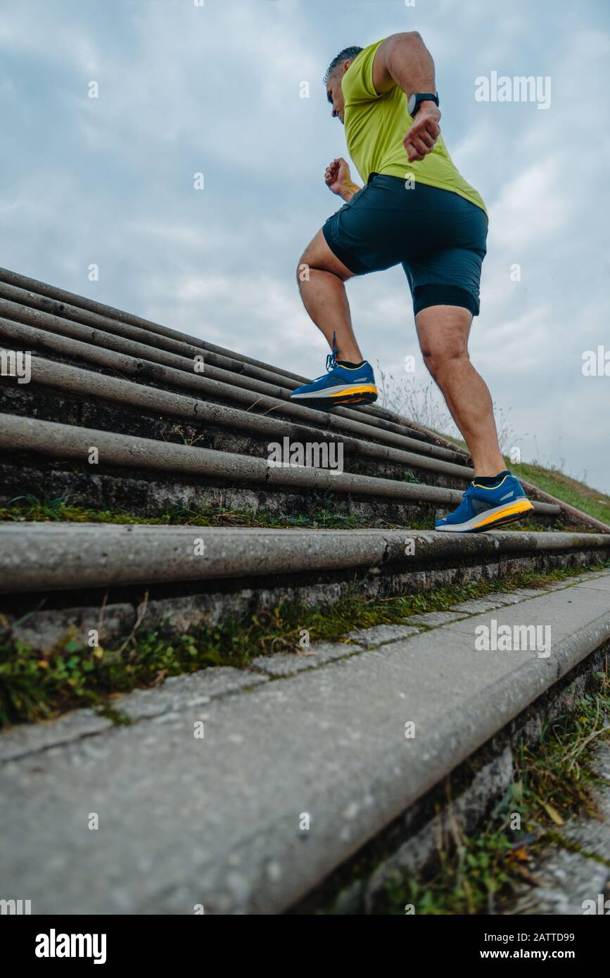 Mature man running up stairs hi-res stock photography and images - Alamy
