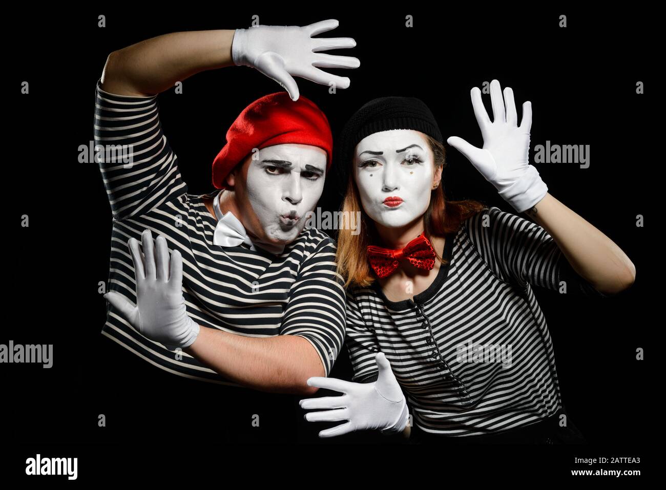 Funny mime artists on black. Striped shirts white gloves and berets Stock Photo Alamy