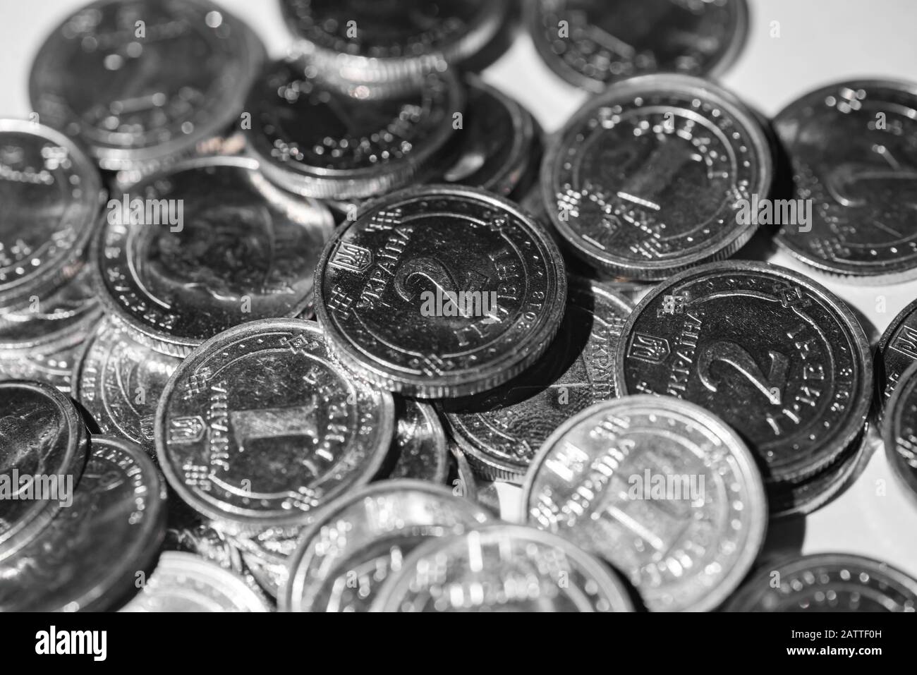 metal coins, one and two hryvnia nominee, slide closeup on a white background Stock Photo