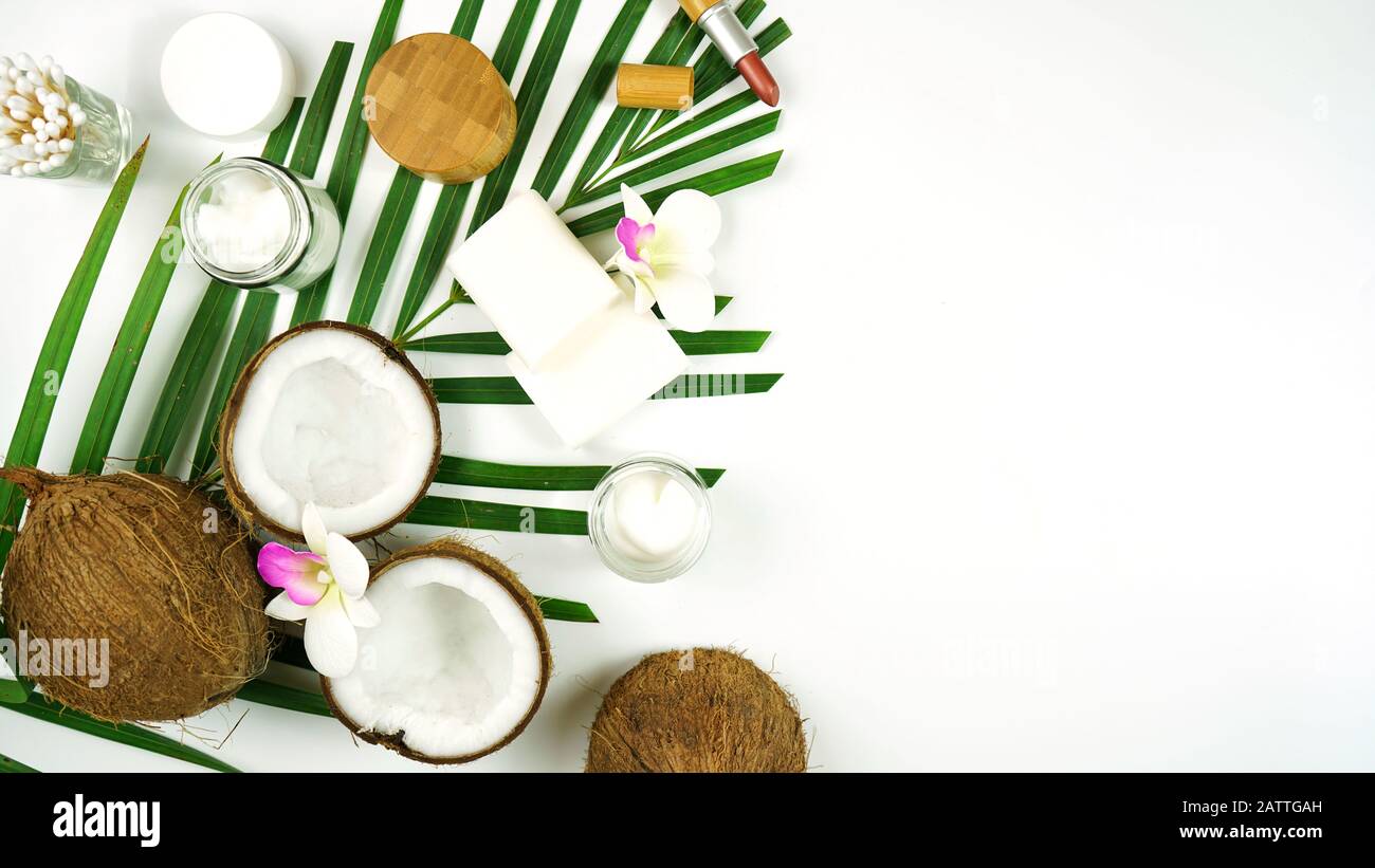 Coconut cosmetics theme flat lay creative layout overhead with pro environment alternative plastic free soaps, moisturizers and beauty products. Negat Stock Photo