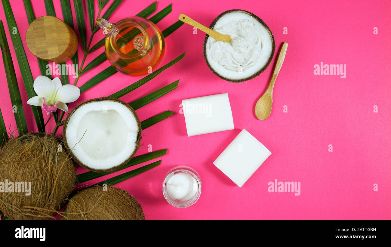 Coconut cosmetics theme flat lay creative layout overhead with pro environment alternative plastic free soaps, moisturizers and beauty products on mod Stock Photo