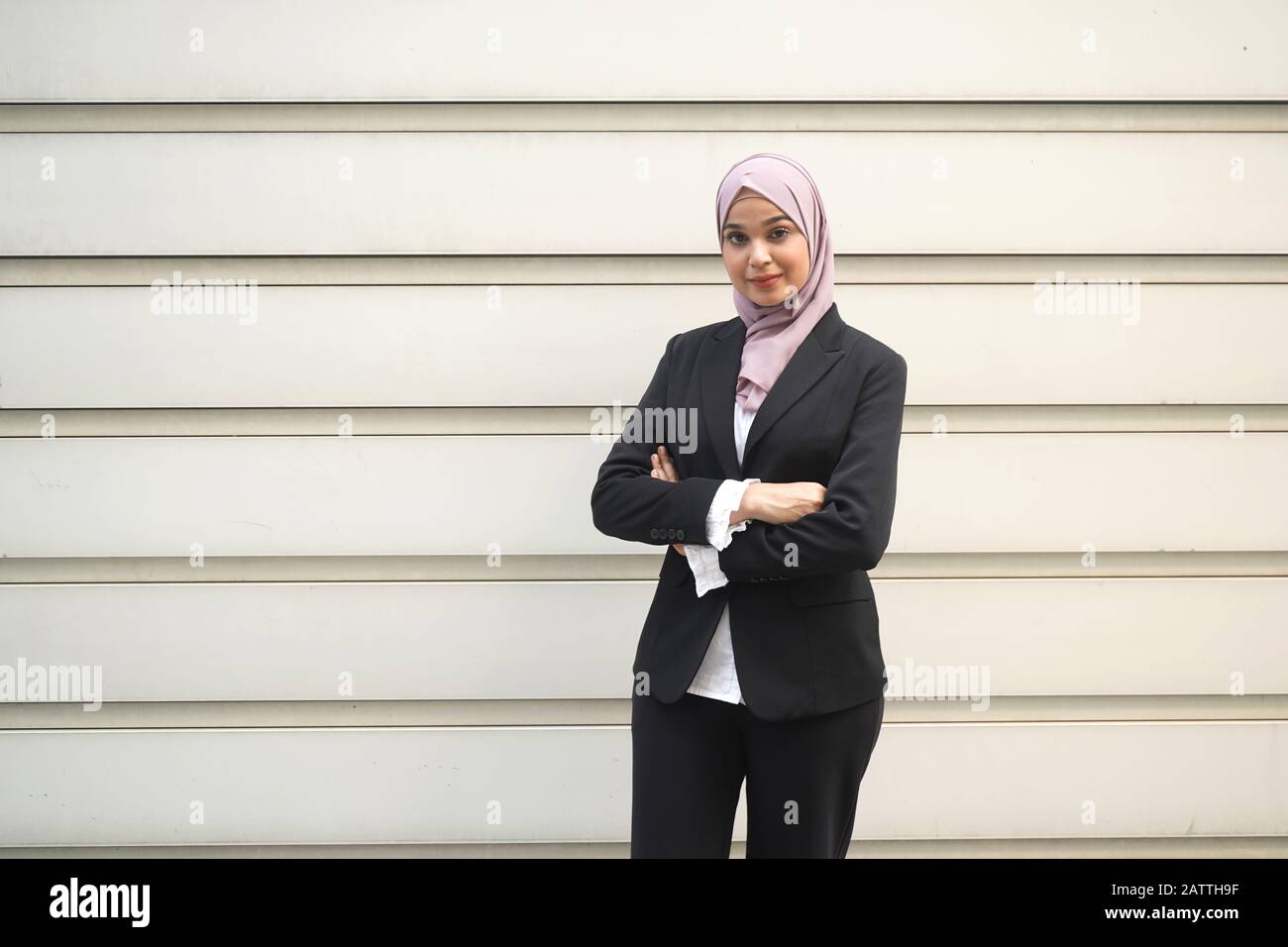 Young asian muslim business woman in head scarf Stock Photo