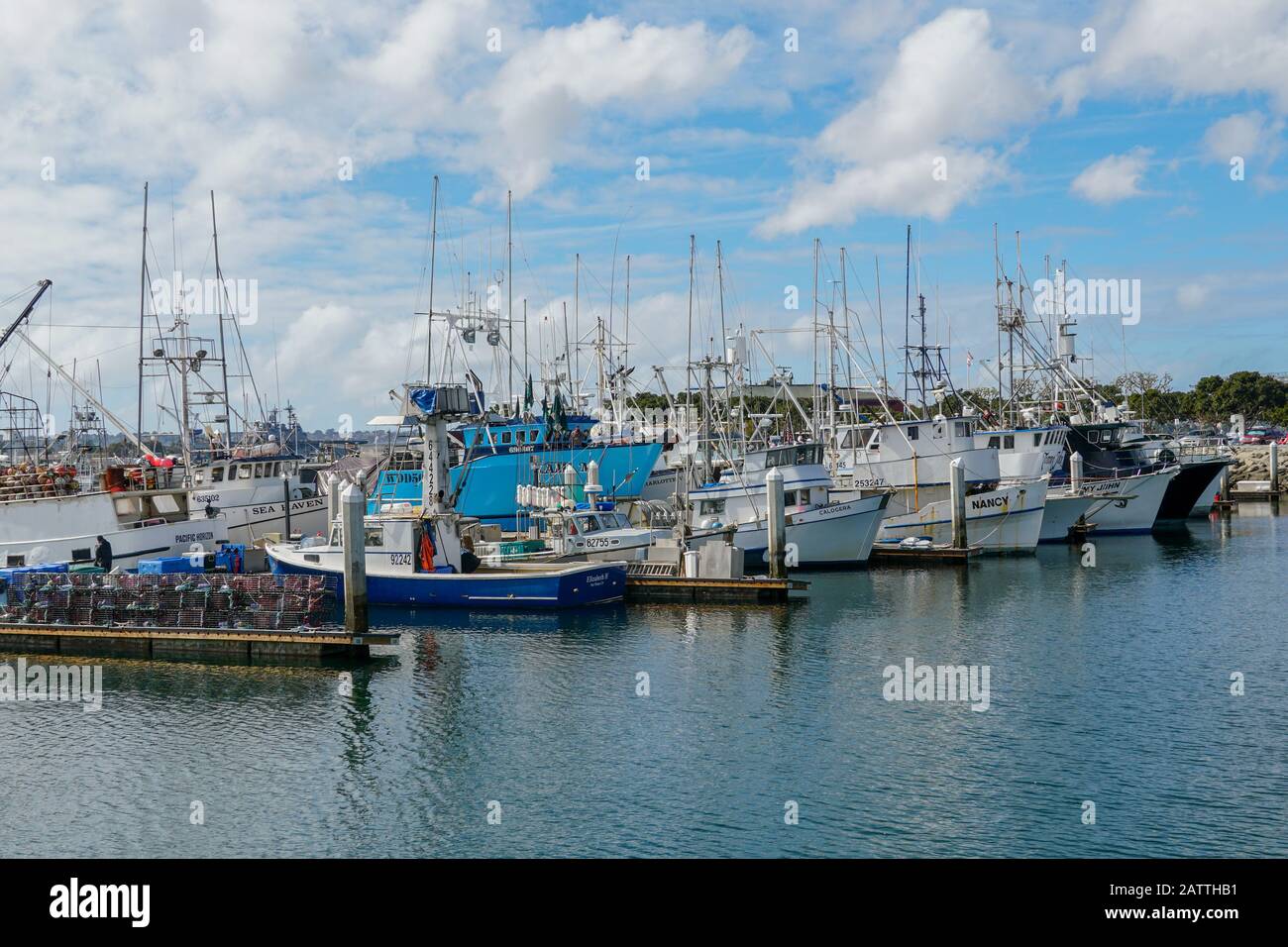 Commercial fishing boats docked in San Diego Harbor. Fish Harbor Pier Located in the downtown area of San Diego adjacent to seaport village. California, USA. January 19, 2020 Stock Photo