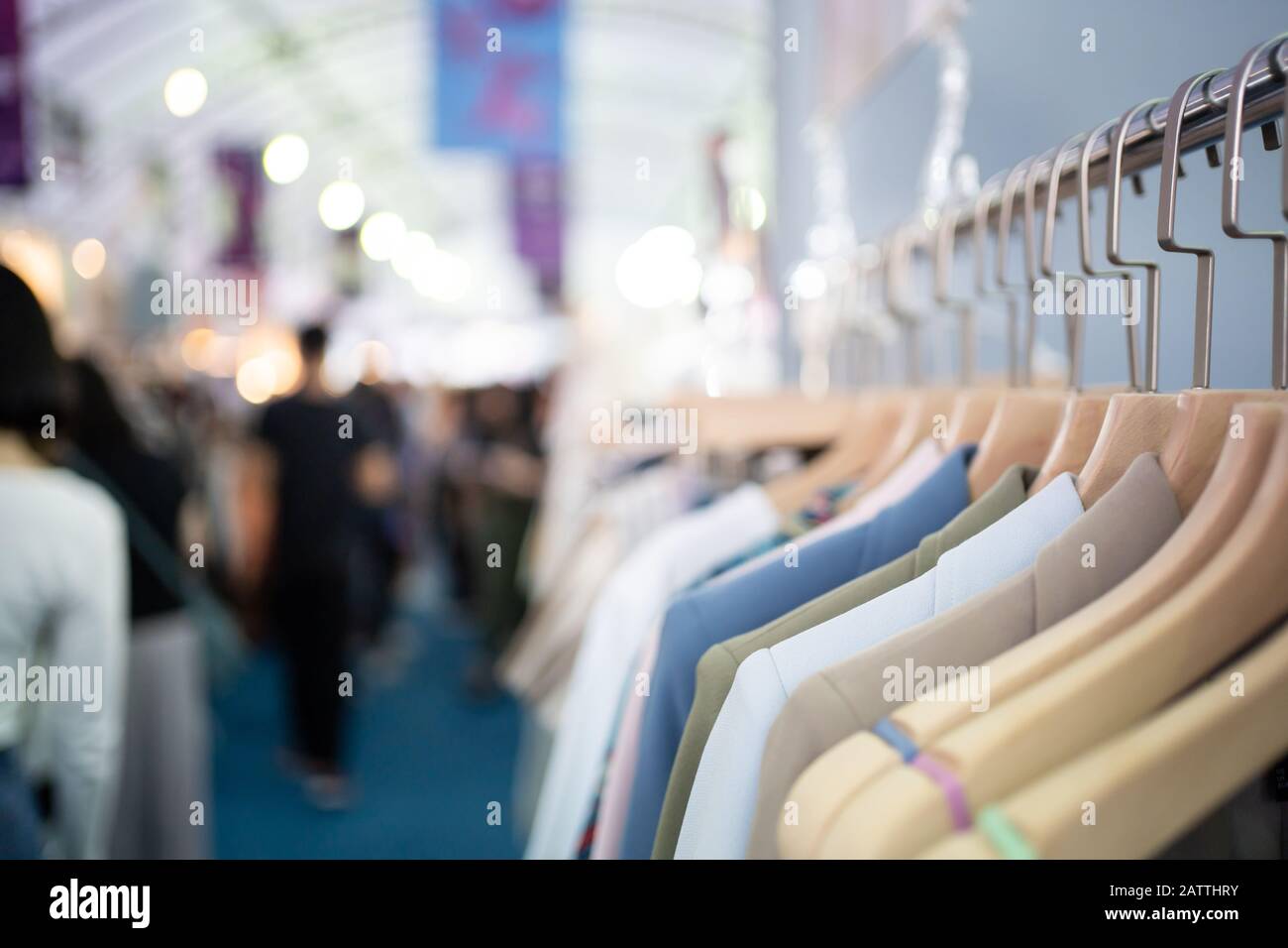 Clothes on clothes rack in the shop Stock Photo - Alamy