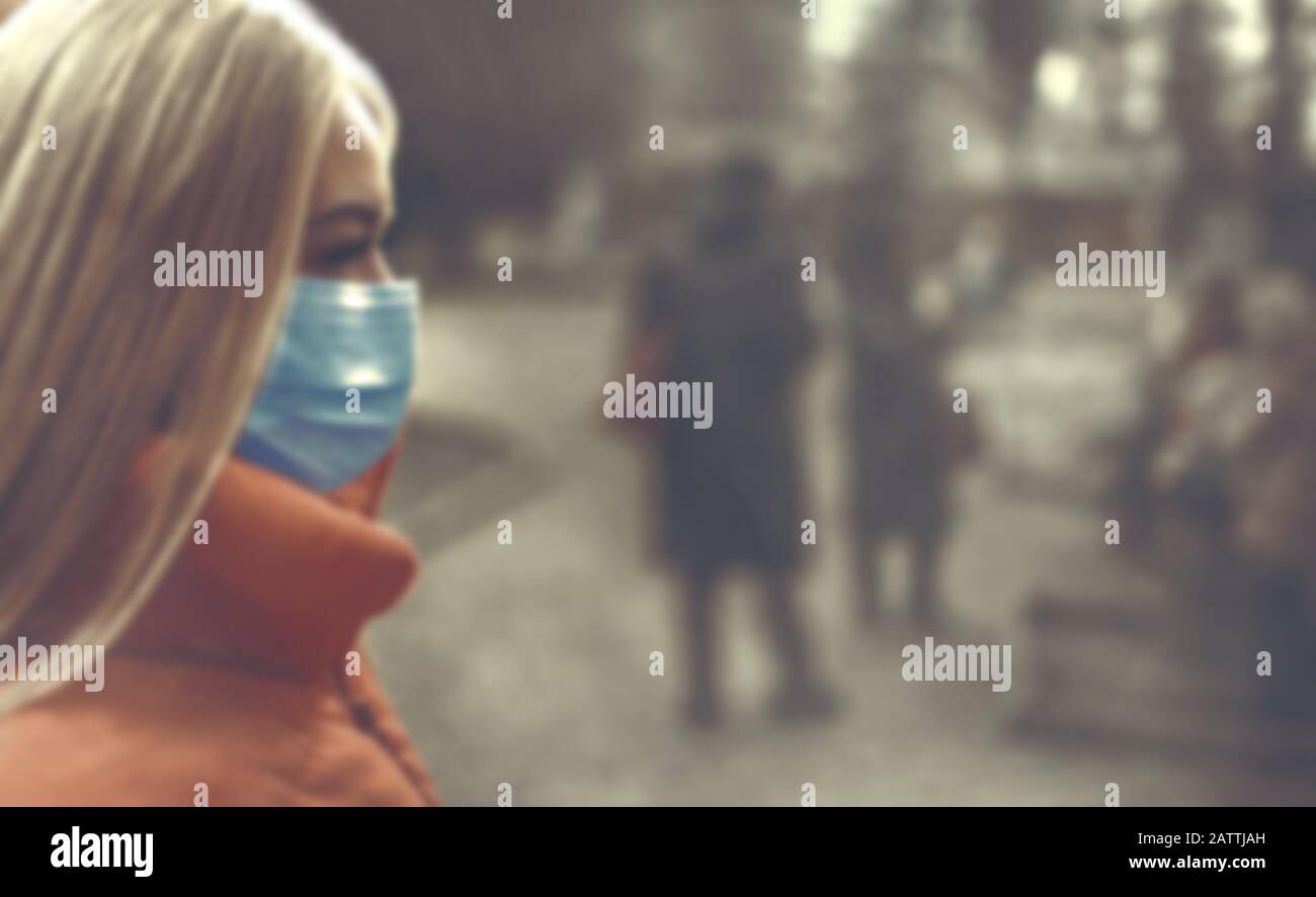 Woman wearing face mask because of air pollution in the city Stock Photo