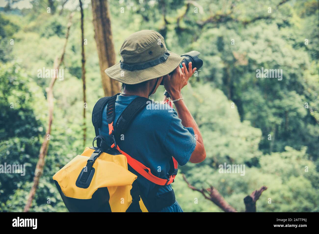 holding camera on nature forest tourist 