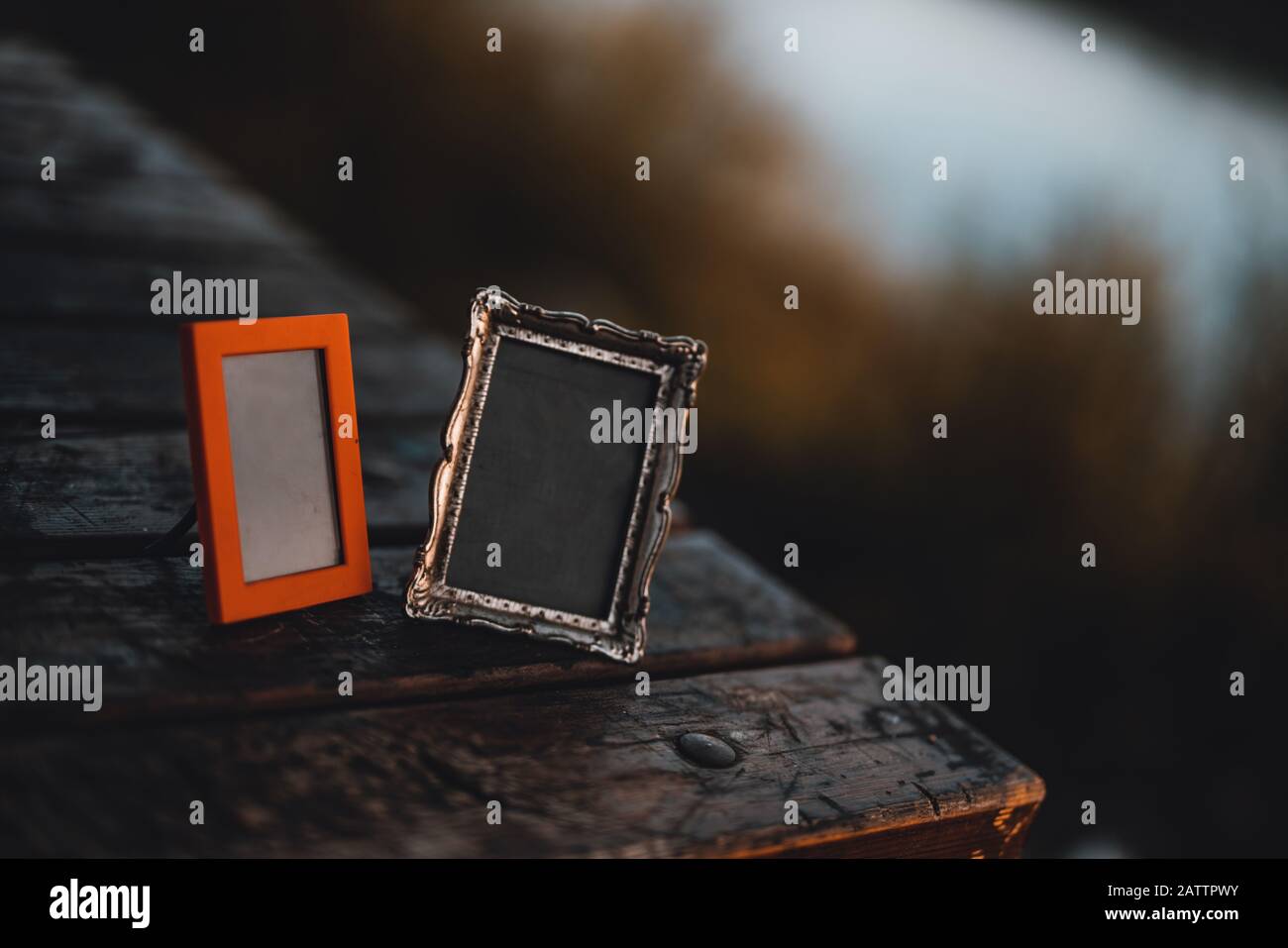 Empty photo frames on the table outside. Background Concept. Stock Photo