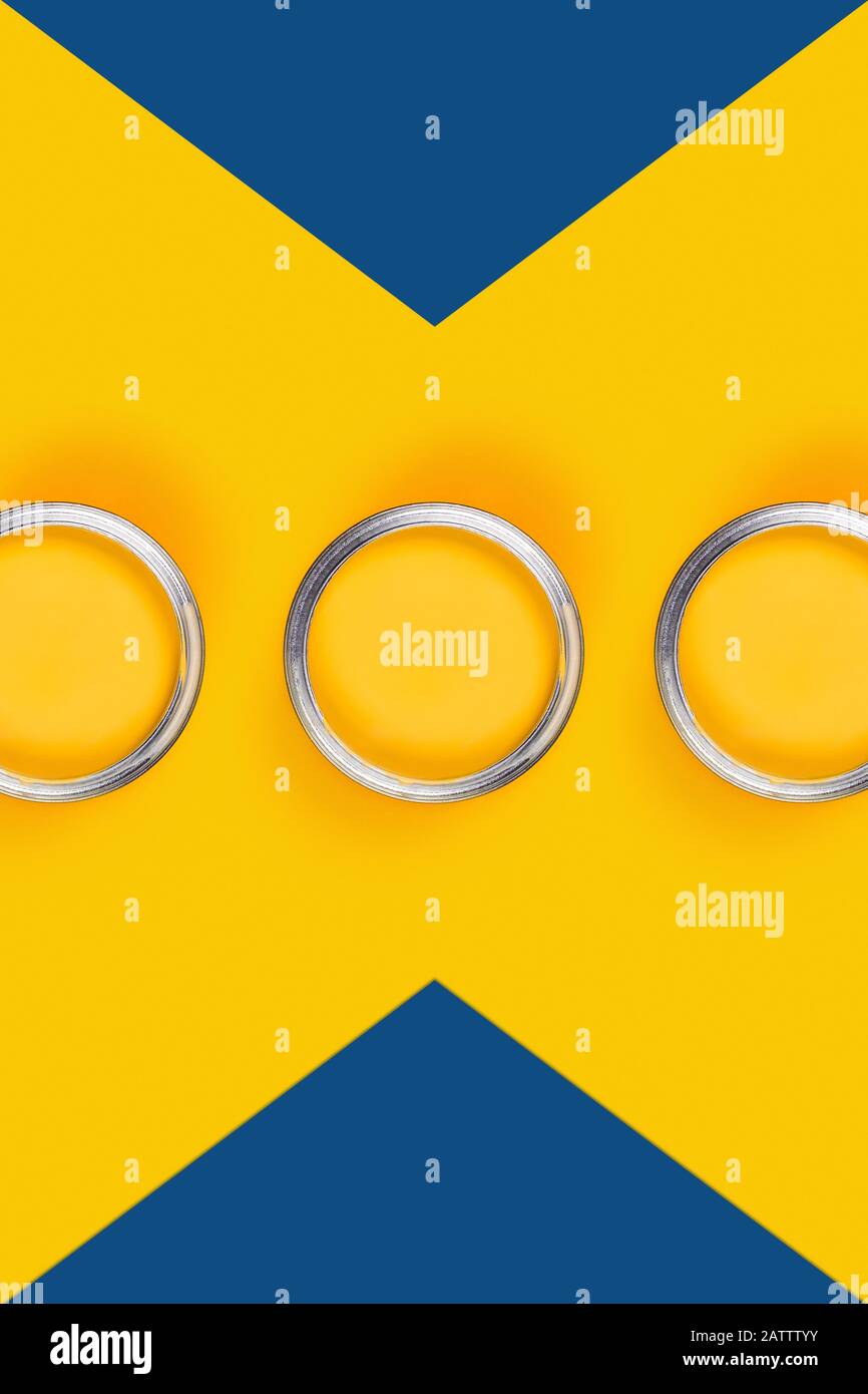 Repair concept. Yellow and classic blue background with three paint cans. Flat lay, top view, copy space. Stock Photo