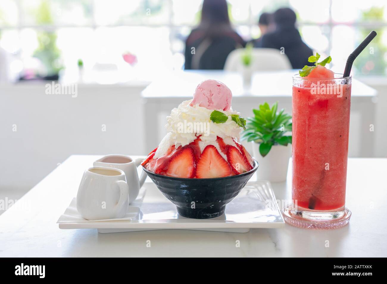 Delicious strawberry ice cream scoop with fresh strawberries on table background Stock Photo