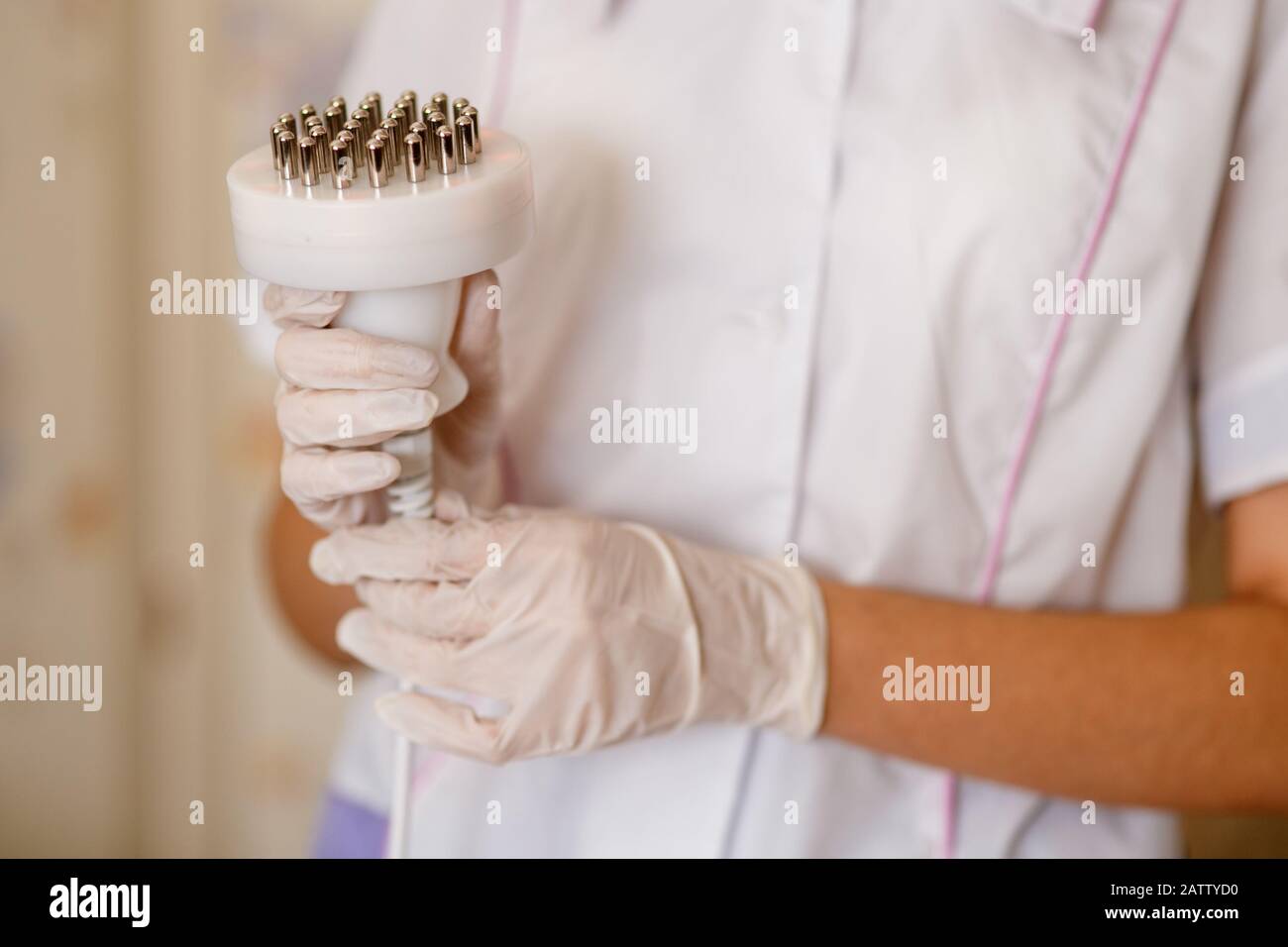 A set of medical instruments for cosmetology apparatus for liposuction and massage, for the correction of the body. Machine Close-up of various tools of medical in hands. Stock Photo