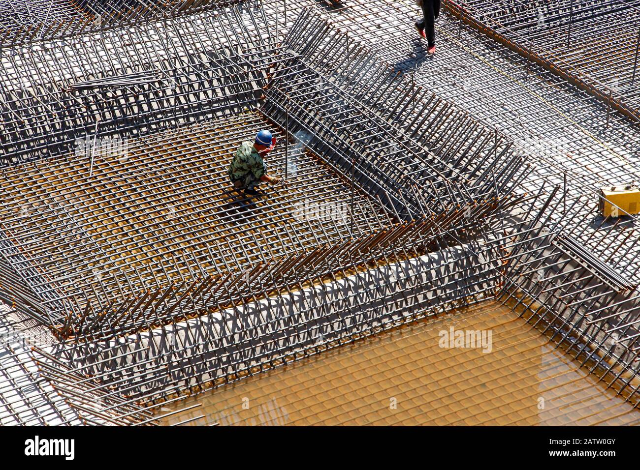 The welding worker in the construction site making reinforcement metal ...