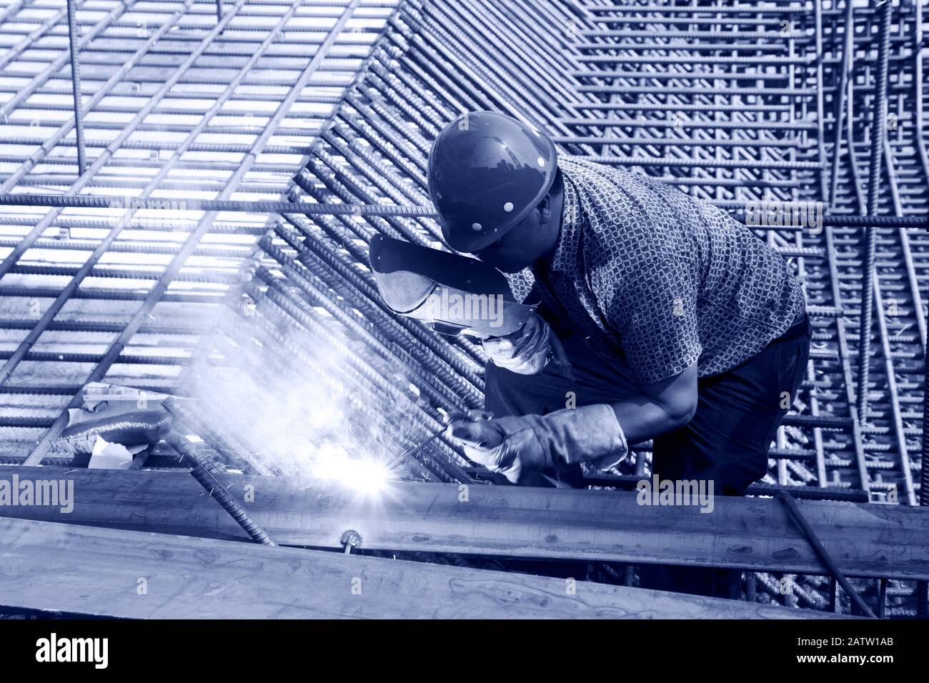 The welding worker in the construction site making reinforcement metal ...