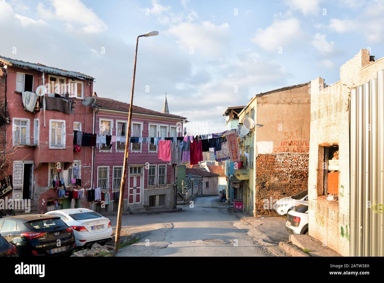 Istanbul, Turkey - January 15, 2020: laundry hanging out to dry at old traditional houses in historical Fatih area of Istanbul Stock Photo