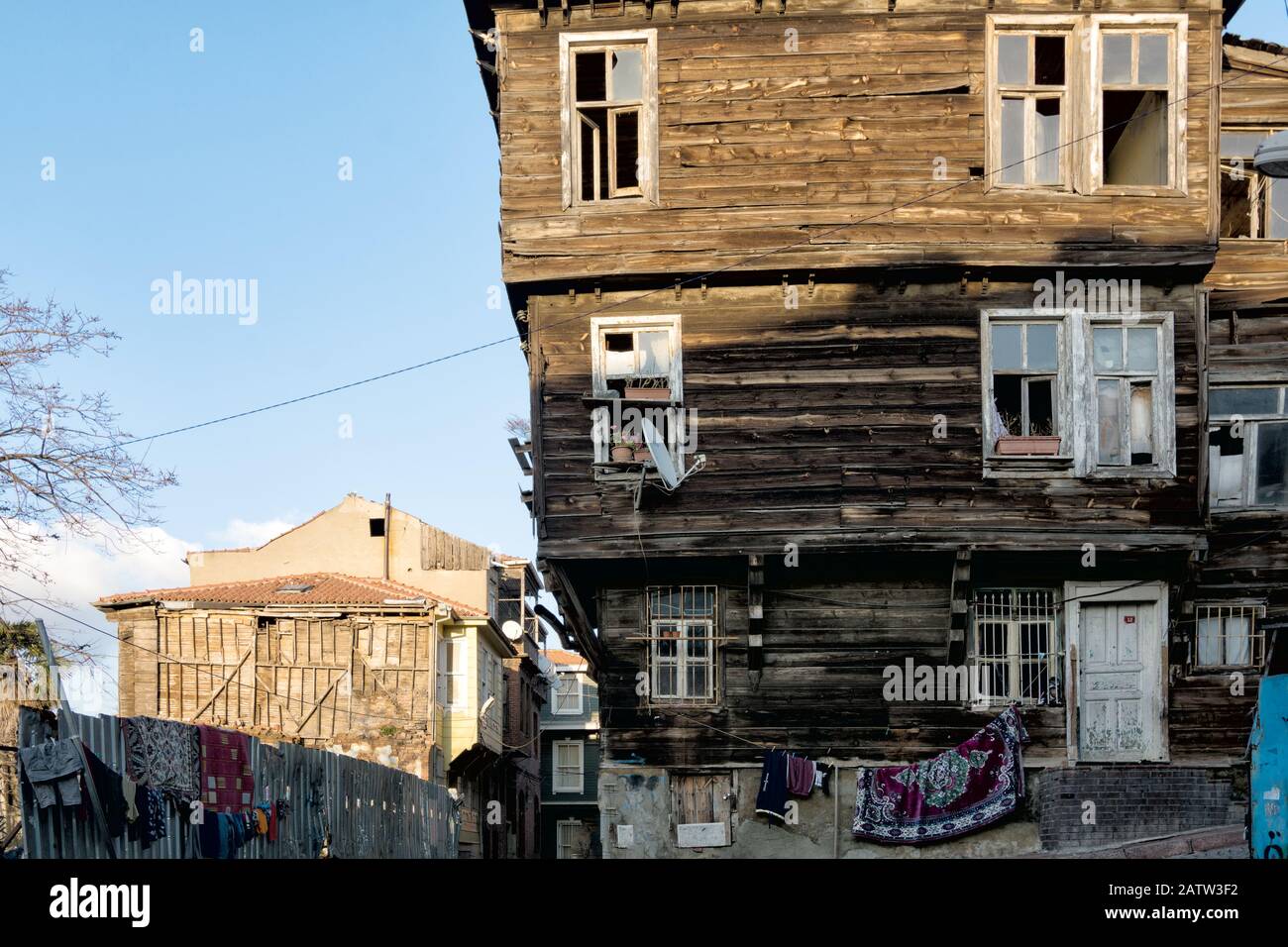 Old houses in historical Fatih area of Istanbul, laundry and rugs hanging out to dry Stock Photo