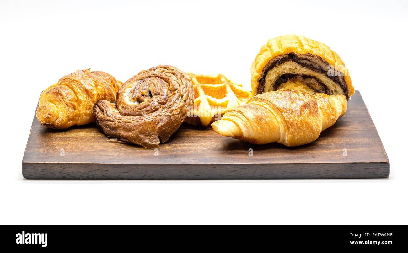 Fresh of Bread  with croissant and waffles on a wooden tray isolate on white background. Stock Photo