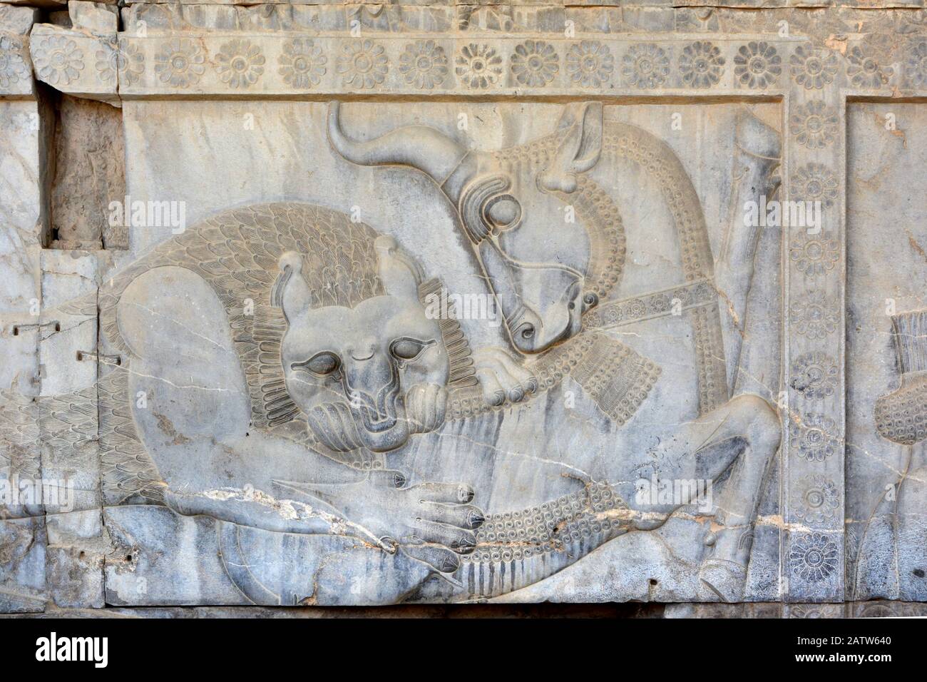 Apadana Palace, Persepolis. Lion and bull at the central facade  of the eastern stairway. Possibly an allegorical symbol for Nowruz. Stock Photo