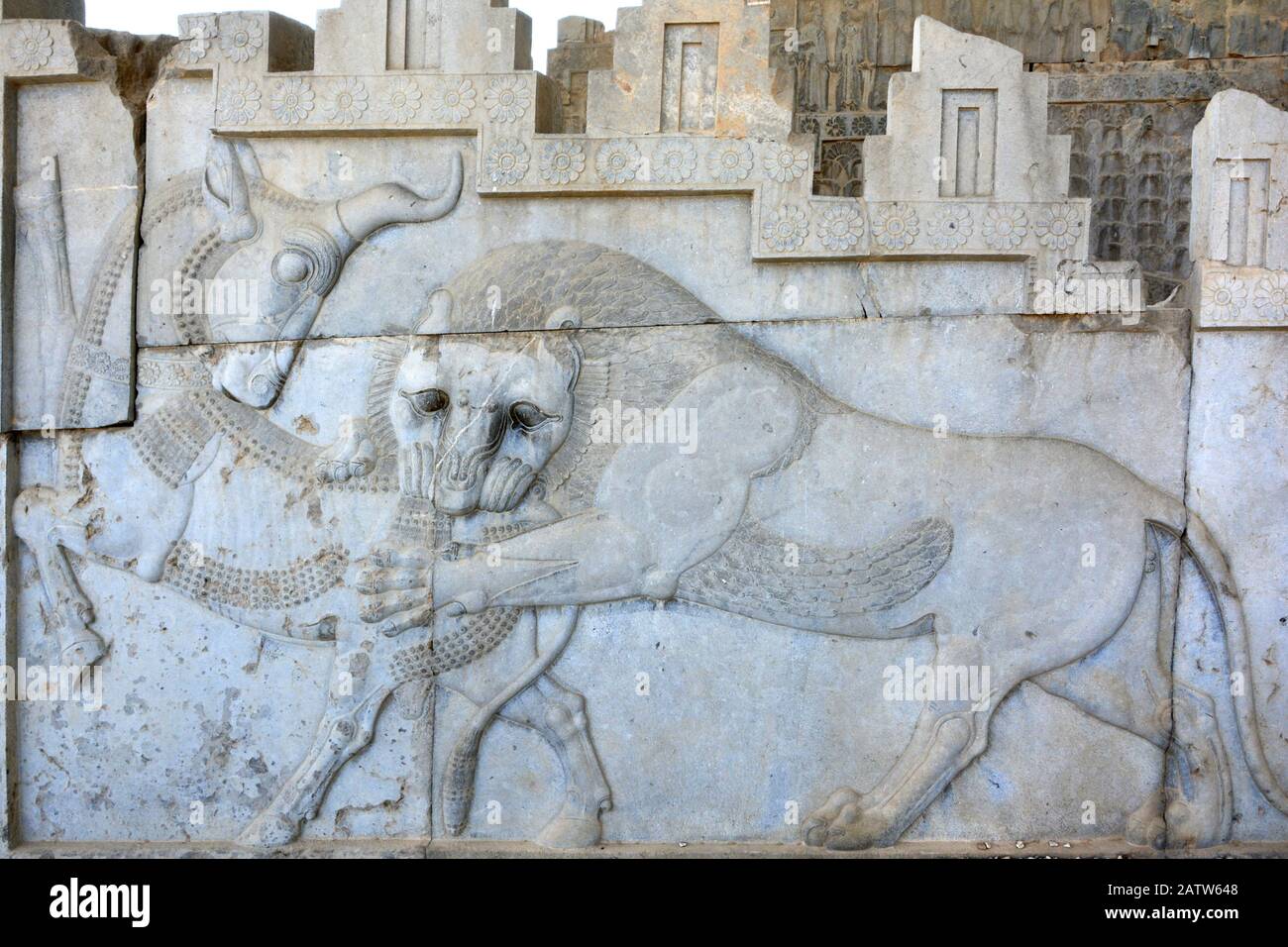 Apadana Palace, Persepolis. Lion and bull at the central facade  of the eastern stairway. Possibly an allegorical symbol for Nowruz. Stock Photo