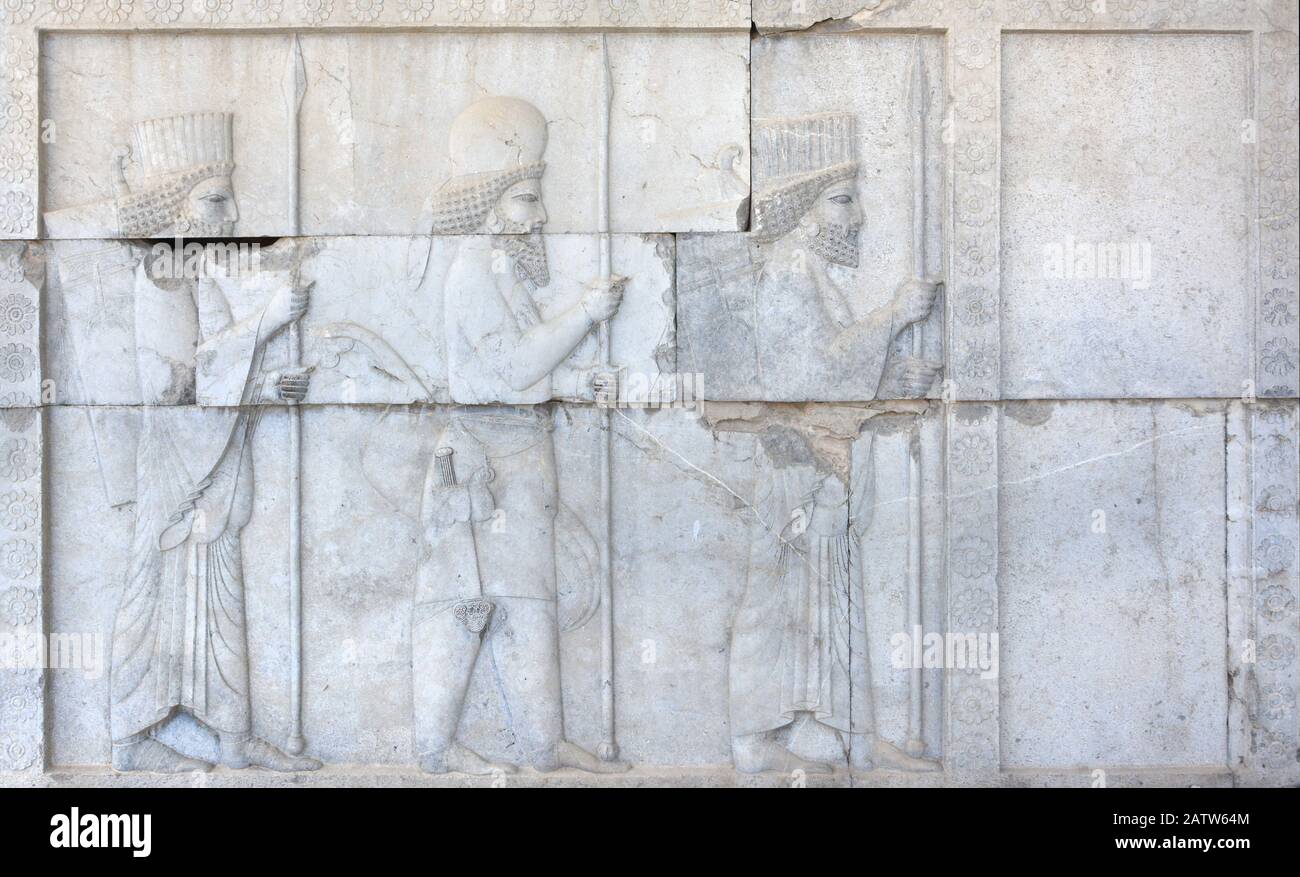 Persian (left and right) and Median (center) soldiers, bas-relief, Apadana Hall, Persepolis, Iran Stock Photo