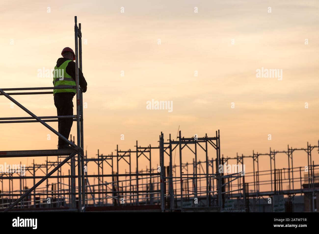 scaffold builder in the dawn Stock Photo