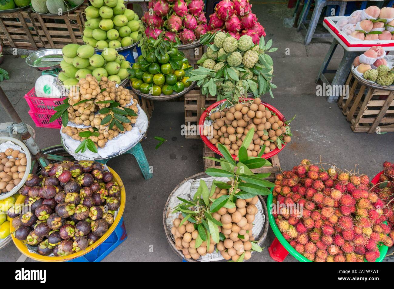 Tropical fruits on sale on street market stall in Vietnam Stock Photo
