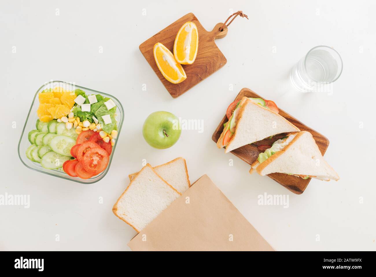 https://c8.alamy.com/comp/2ATW9FX/mother-cooking-school-lunch-box-set-preparing-healthy-snacks-cheese-sandwich-fruits-and-vegetable-in-paper-bag-2ATW9FX.jpg