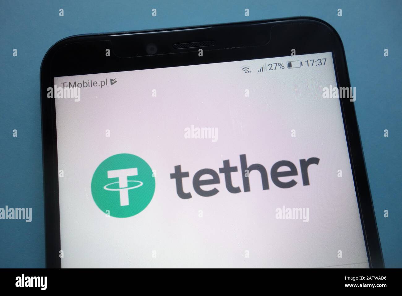 Tether cryptocurrency logo on smartphone Stock Photo