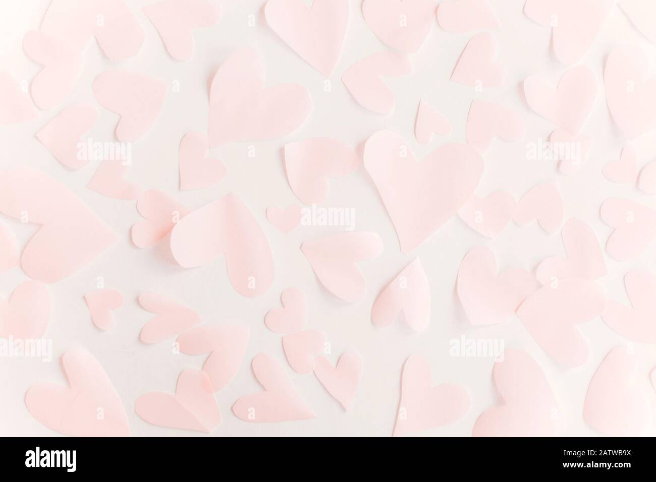 Happy valentines day. Cute pink pastel hearts on white paper background ...