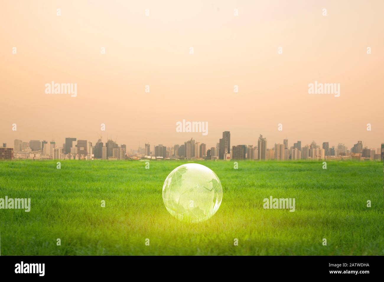 The  globe with the background of many large building. Global warming and pollution theme . Conceptual image symbolizing global warming leading to des Stock Photo
