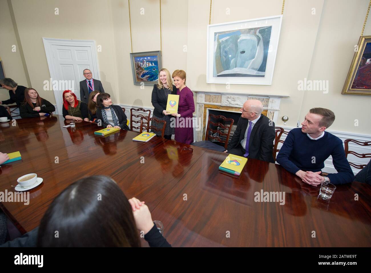 Edinburgh, UK. 5th Feb, 2020. Pictured: (L-R) Laura Beveridge - Independent Care Review; Nicola Sturgeon MSP - First Minister of Scotland and Leader of the Scottish National Party (SNP); John Swinney MSP - Deputy First Minister of Scotland. Nicola Sturgeon - First Minister of Scotland receives a copy of the Independent Care Review report from Laura Beveridge and care experienced young people Credit: Colin Fisher/Alamy Live News Stock Photo