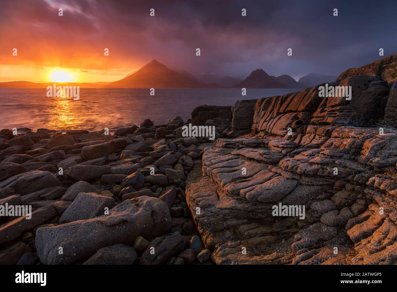 Sunset over the Cullin Mountains from Elgol shoreline, Isle of Skye, Scotland, UK, April. Stock Photo