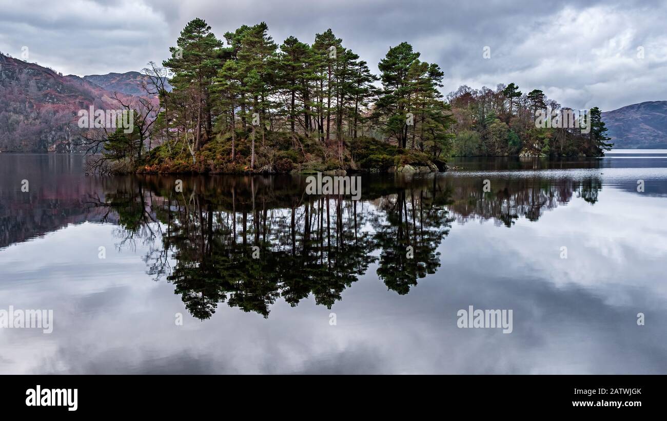 A calm winters day at Loch Katrine the source of much of Glasgows drinking water.The loch is a scenic attraction in the Trossachs area of the Scottish Stock Photo