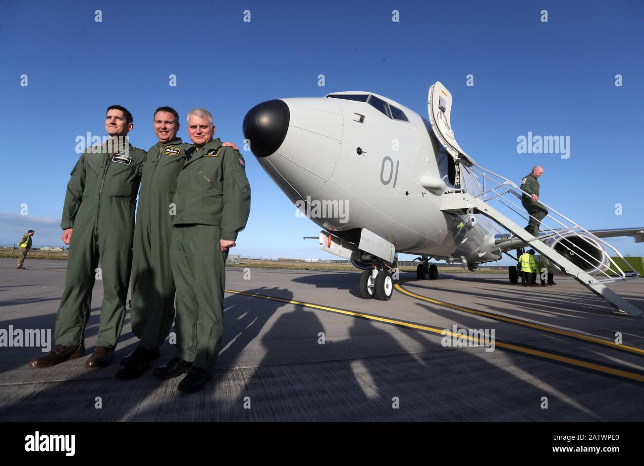 Squadron Leader Mark Faulds ( c) poses for a photograph at Kinloss Barracks in Morayshire after he flew-in the UK's first submarine-hunting P-8A Poseidon maritime patrol aircraft from NAS Jacksonville in the USA. Picture date: Tuesday February 4, 2020. The UK is buying nine of the Boeing jets which are equipped with sensors and weapons systems for anti-submarine warfare, as well as surveillance and search and rescue missions. The aircraft will be based at Kinloss Barracks until they move permanently to RAF Lossiemouth whose runway is currently being resurfaced. Photo credit should read: Andrew Stock Photo