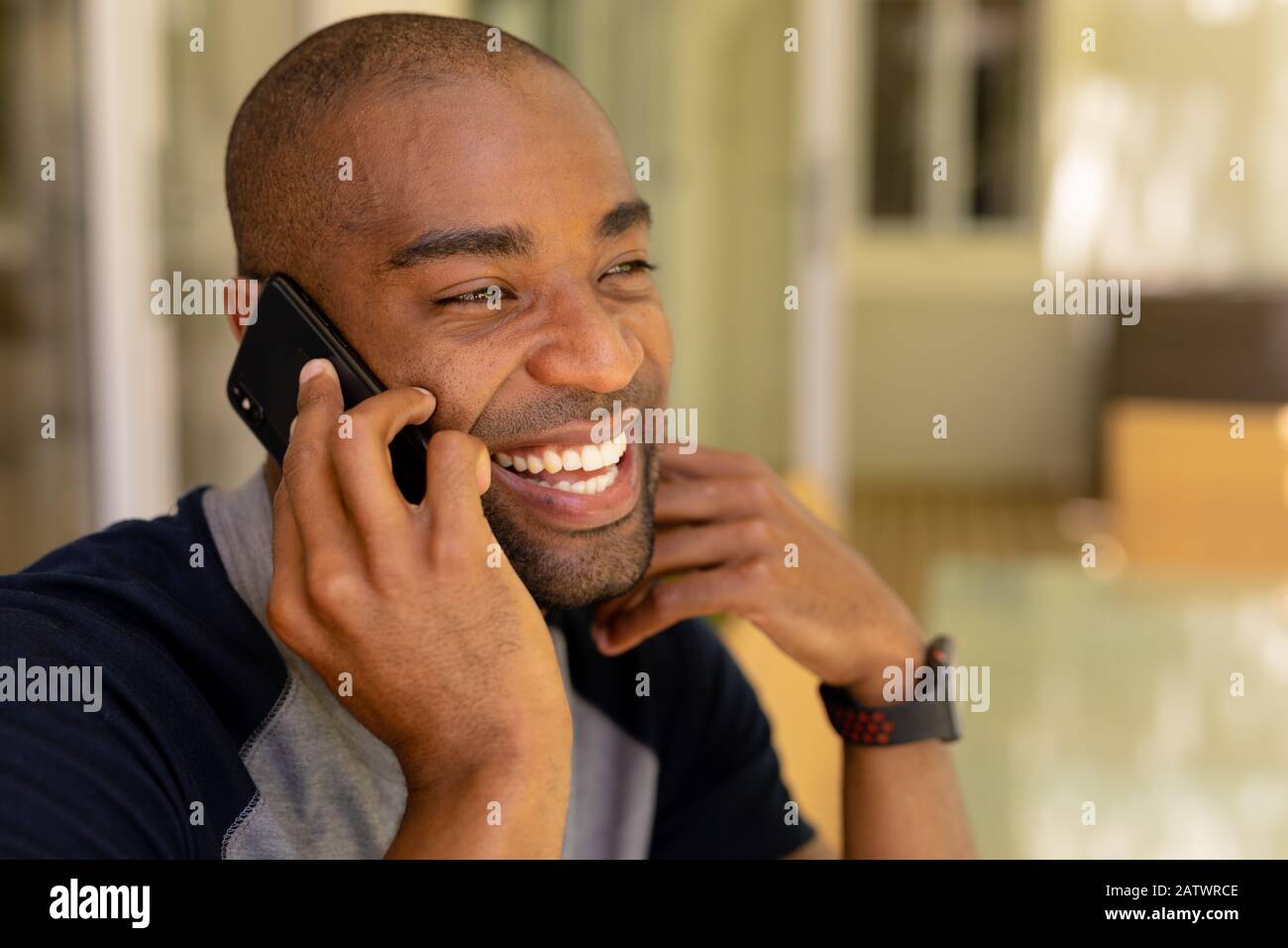 Young man talking on his mobile phone Stock Photo