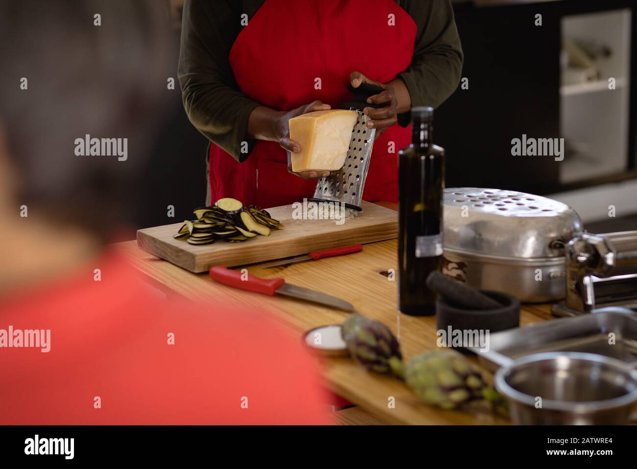 African chef rapping cheese Stock Photo