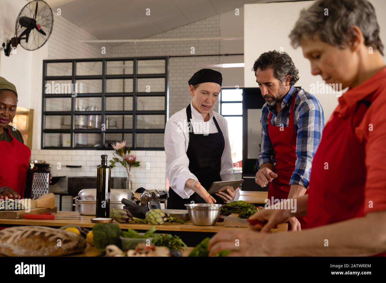 Chefs cooking together Stock Photo
