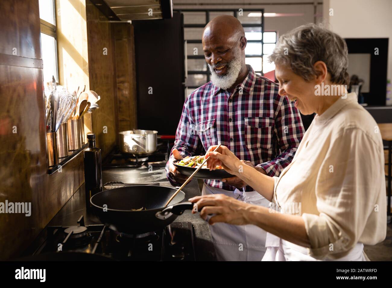 Old chefs cooking together Stock Photo