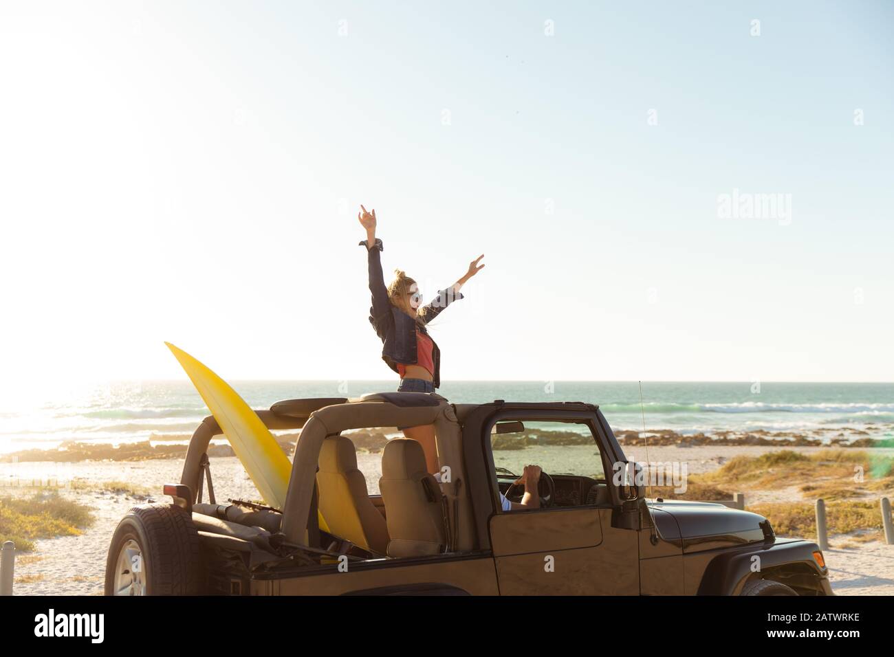 Couple in a car at the beach Stock Photo
