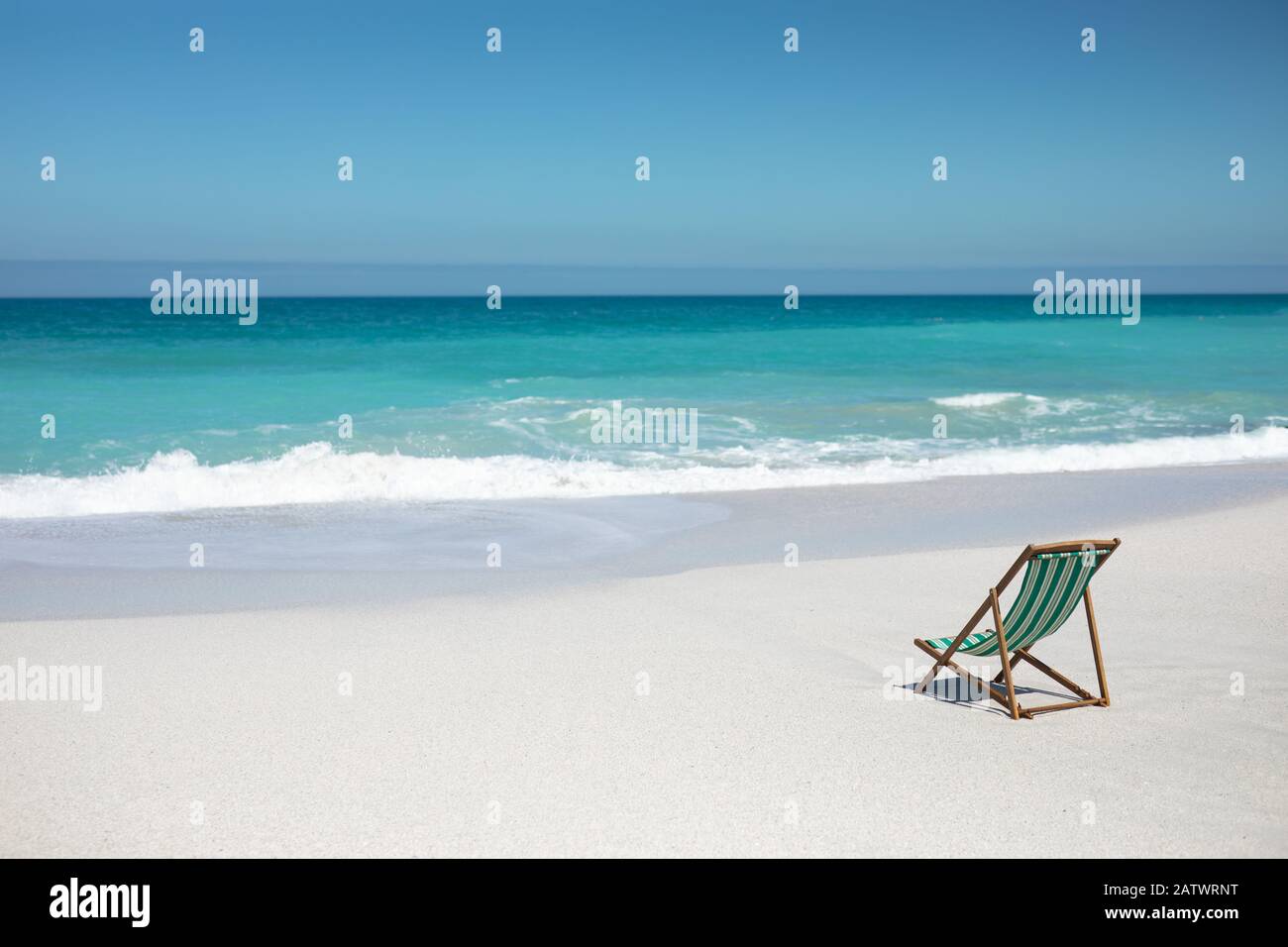 Chair in front of the waves Stock Photo