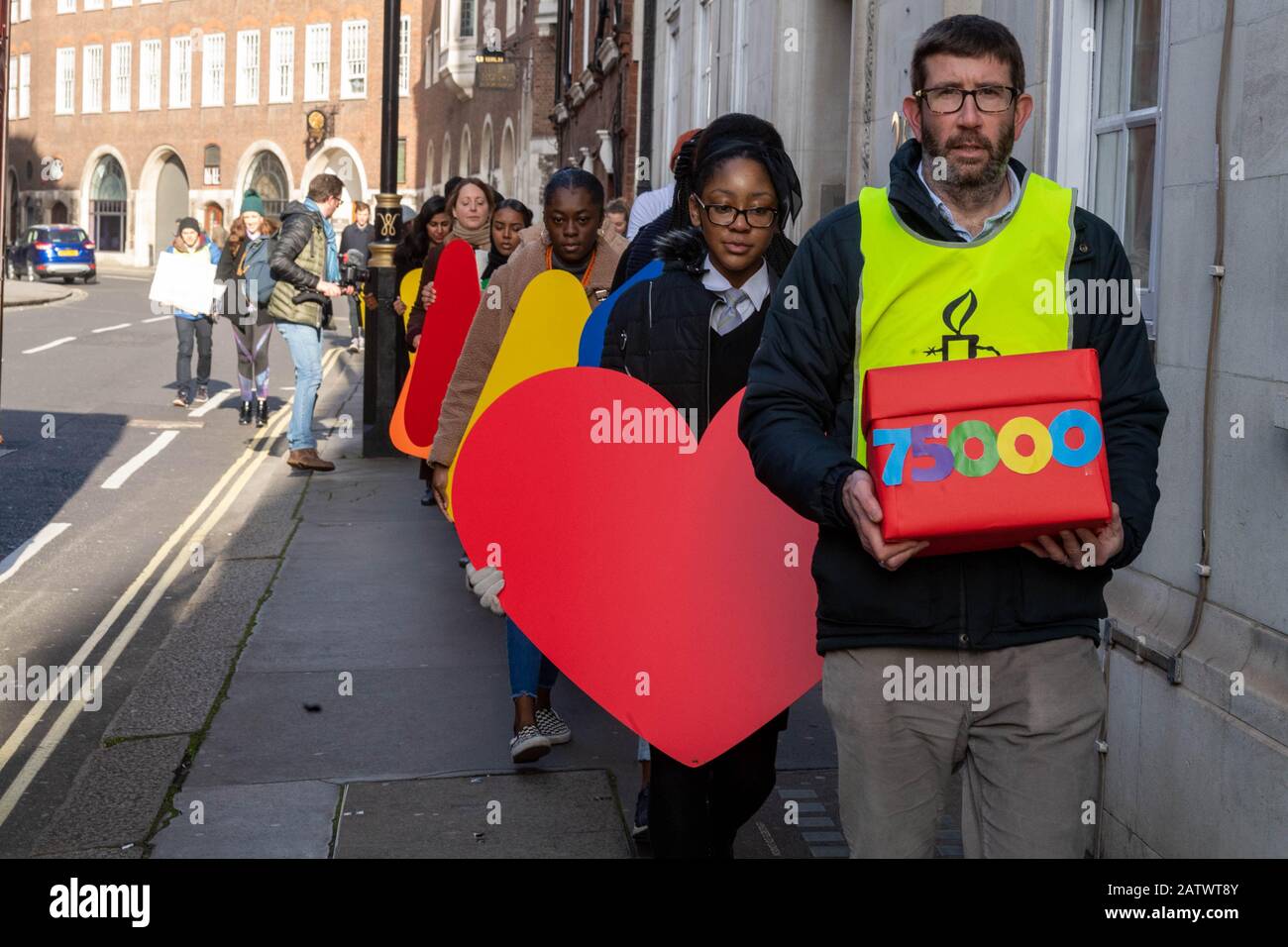London, UK. 5th Feb, 2020. 'Amend UK's destructive refugee reunion laws' - Amnesty International hands petition to Government, part of the 'keep families together' campaign Credit: Ian Davidson/Alamy Live News Stock Photo