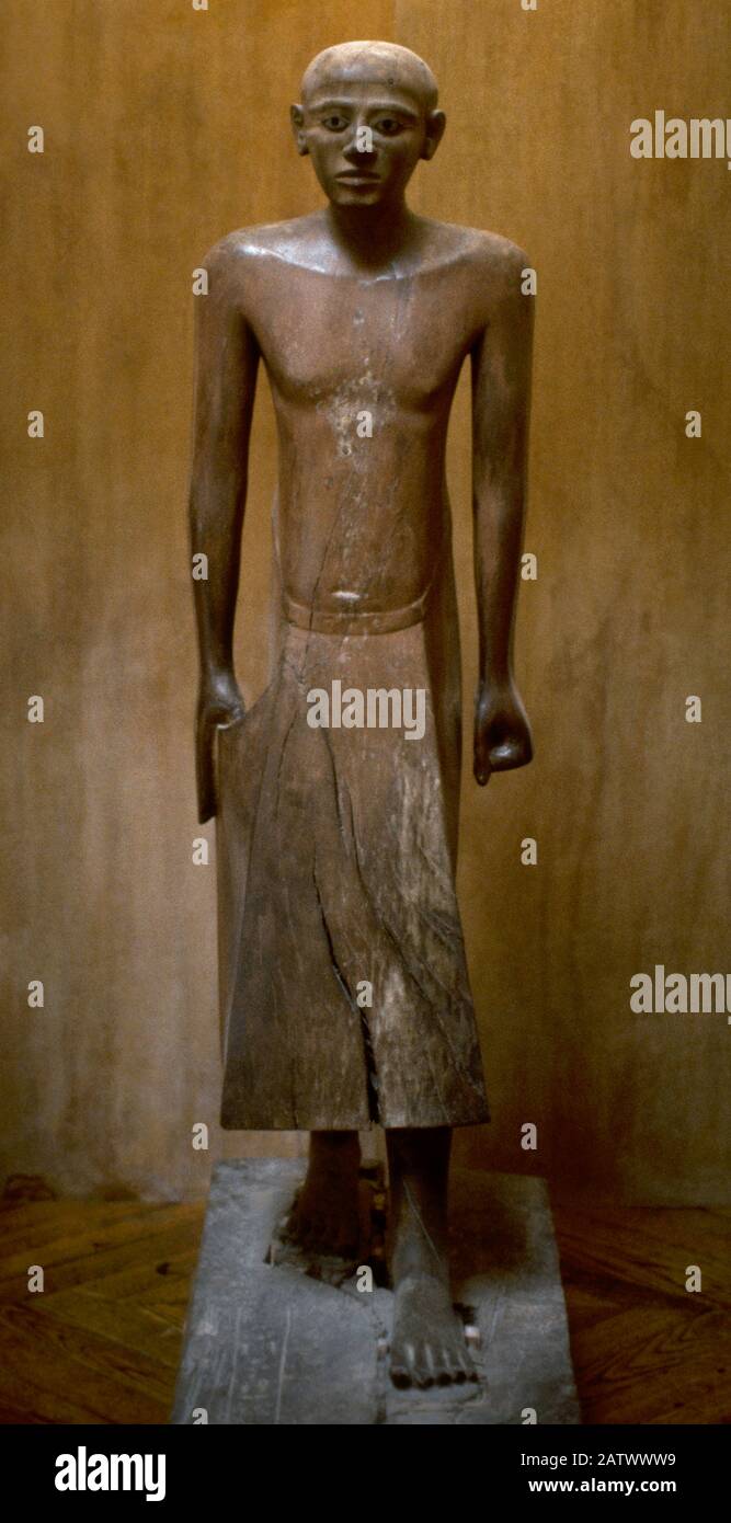 Statue of Egyptian Chancellor Nakhti. Middle Empire. 20th century BC. Polychromed acacia wood. From his tomb in Asyut, Egypt (tomb number 7). Louvre Museum. Paris, France. Stock Photo
