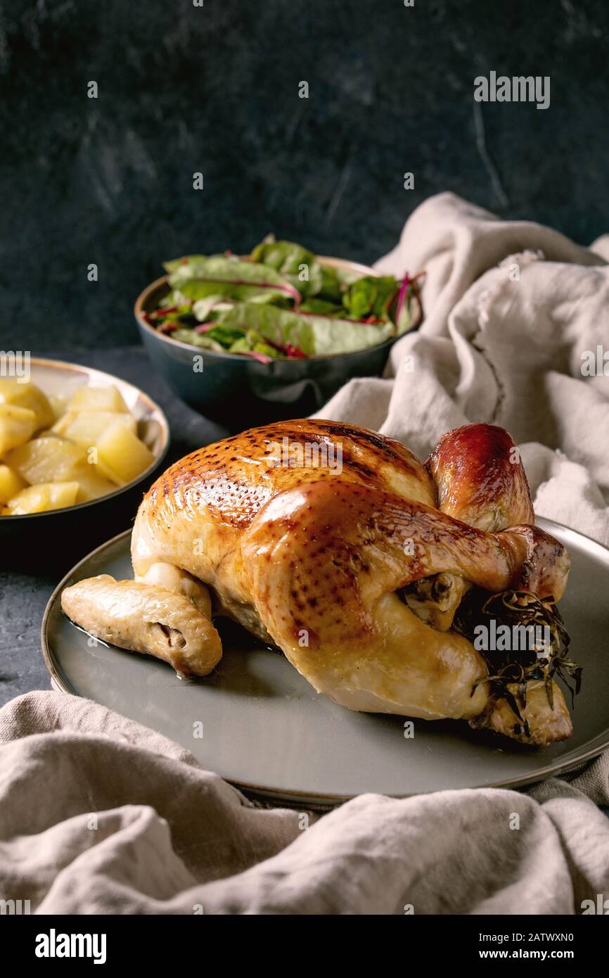 Baked chicken with potatoes Stock Photo - Alamy